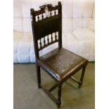 Late 19th/early 20th Century oak framed hall chair having a tooled leather seat and back and
