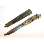 19th Century Indian dagger having a carved and pierced foliate design bone hilt and a nickel