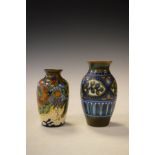 Two Gouda pottery vases, each having typical stylised foliate decoration Condition: