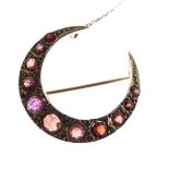 9ct gold crescent shaped brooch set graduated garnet coloured stones Condition: