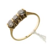 Three stone diamond ring, the shank stamped 18ct, size Q Condition: