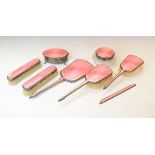 George V silver and pink enamel dressing table set comprising: oval trinket box, cut glass powder