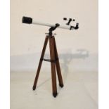 Prinz Optics astronomical telescope, model 330, on a wooden tripod base Condition: