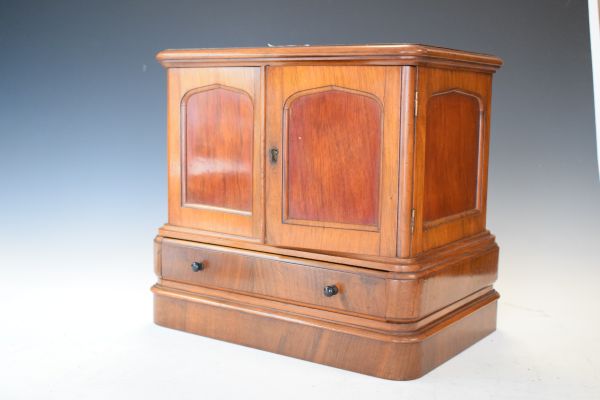 Late 19th/early 20th Century mahogany and walnut table cabinet, fitted two panelled doors