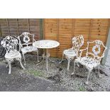 Cast aluminium Victorian style circular garden table and pair of chairs and a pair of similar