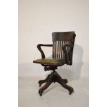 Early 20th Century oak swivel lath back armchair Condition: