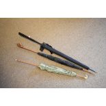 Three vintage lady's umbrellas, each having a decorative handle Condition: