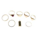 Quantity of 9ct and gold coloured metal dress rings and an ingot shaped pendant stamped 375