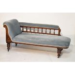 Late Victorian walnut framed chaise longue upholstered in blue dralon and standing on turned