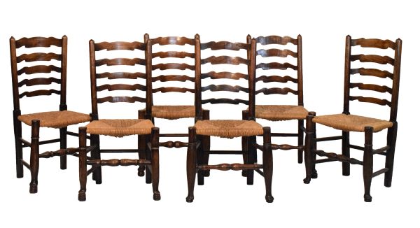 Matched set of six 19th Century ash and oak ladder back dining chairs, each having a rush seat and