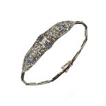 Diamond and calibré synthetic sapphire bracelet, circa 1920, the centre stone of approximately 0.2