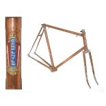 Vintage Carpenter steel racing cycle frame in a polished copper finish, bearing red, white and