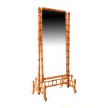 Large Aesthetic School satin walnut faux bamboo framed cheval mirror standing on four splayed