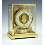 Jaeger-Le-Coultre Atmos clock Calibre 526-5 having a typical brass case, the off-white chapter