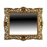 Late 19th/early 20th Century carved giltwood framed rectangular wall mirror having pierced foliate