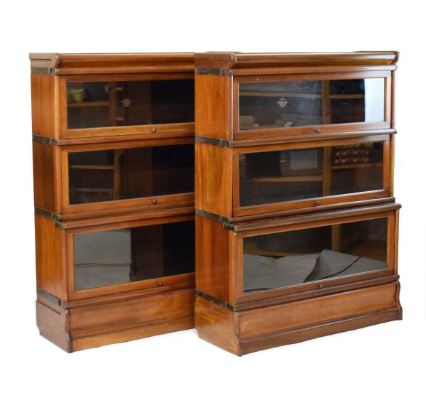 Pair of early 20th Century Globe Wernicke mahogany three tier sectional bookcases, each fitted up-
