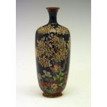 Japanese cloisonné baluster shaped vase finely decorated with stylised foliage on a green ground,