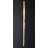 19th Century Cantonese carved ivory parasol handle, having floral and architectural decoration, 30.