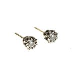 Pair of illusion set diamond single stone ear studs, the brilliant cuts totalling approximately 0.