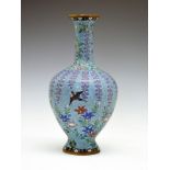 Japanese cloisonné baluster vase, Meiji period, decorated with birds amongst trailing foliage on a