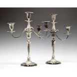 Pair of Georgian style silver plated three branch candelabra, each standing on a tapered fluted