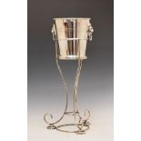 Silver plated ice bucket and stand, the bucket having a cast rim and lion mask ring drop handles,