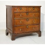 18th Century oak chest fitted two short and three long graduated drawers having brass pear shaped