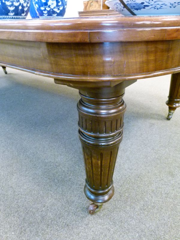 Late Victorian walnut rectangular extending dining table fitted three insertions and standing on - Image 7 of 9