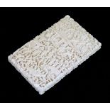 Cantonese carved ivory visiting card case typically decorated with figures amongst dense foliage and