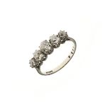 Five stone diamond ring, the white mount stamped '18ct & Pt', the graduated old brilliant mine