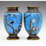 Pair of Japanese cloisonné ovoid vases, Meiji period, each decorated with storks in flight and