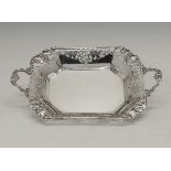 George VI silver fruit basket of rectangular form having cast grape vine handles and conforming