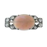 Opal and diamond plaque brooch, the oval shallow cabochon approximately 21mm x 16.5mm x 6mm deep,