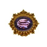 Victorian amethyst gold brooch/clasp, unmarked, the oval cut stone approximately 2.4cm x 1.9cm, 16.