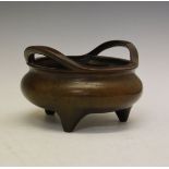 Chinese bronze two handled tripod censer, the underside with Xuande six character mark within a