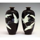 Pair of Japanese cloisonné slender ovoid vases, having fine ginbari decoration depicting storks in