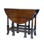 18th Century walnut two flap oval gate leg tea table fitted one drawer, standing on tapered ring