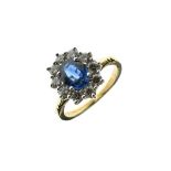 Diamond and sapphire 18ct gold cluster ring, the oval cut sapphire measuring approximately 7.5mm x