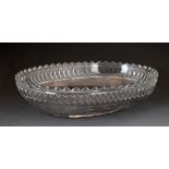 Regency glass oval bowl having a castellated rim, decorated with a band of diamond cut decoration