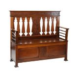 Early 20th Century mahogany box seat hall settle in the manner of Shapland & Petter, the raised back