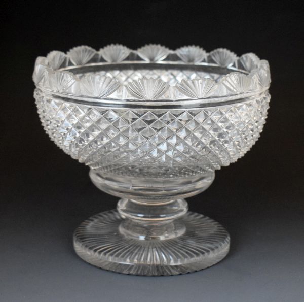 Regency cut glass bowl having a fan cut rim, standing on a short knopped stem and circular foot,