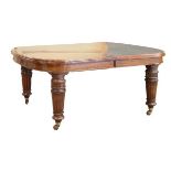 Late Victorian walnut rectangular extending dining table fitted three insertions and standing on