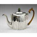 Large George III silver teapot, the oval body with vertical fluted decoration, walnut scroll