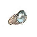 Contemporary aquamarine and diamond ring, the white mount unmarked, the oval cut aquamarine 18mm x