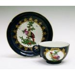 18th Century Worcester tea cup and saucer, each with polychrome painted reserve depicting exotic