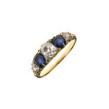 Diamond and sapphire five stone ring, unmarked, the three old brilliant cuts totalling approximately