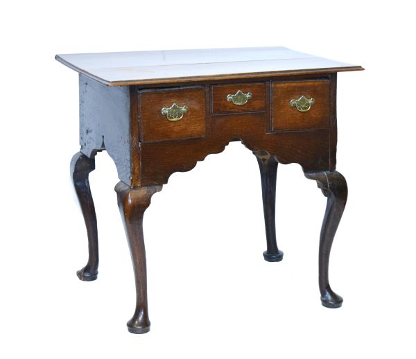 18th Century oak lowboy fitted three drawers having a shaped apron below and standing on cabriole