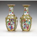 Pair of Cantonese Famille Rose baluster vases typically decorated with alternate reserves
