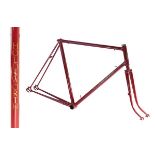 Holdsworth steel racing cycle frame in burgundy with gold transfers and gold piping to the lug work,