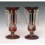 Pair of Bohemian ruby flash glass lustre drop vases, each having engraved grapevine decoration, 28.